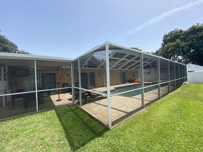 Complete rescreen of a waterfront pool enclosure on Isle of Capri, St. Petersburg